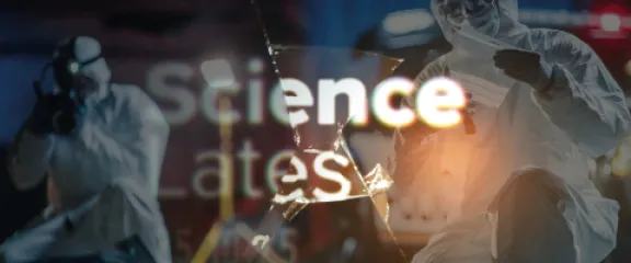 Science Lates - a forensics team work behind cracked glass