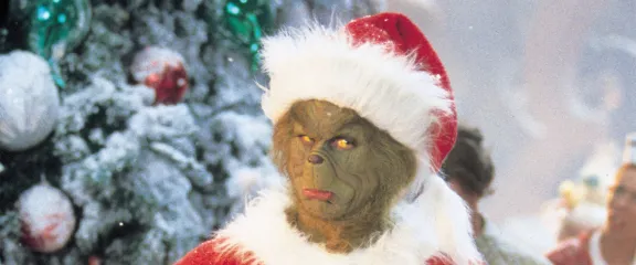 The Grinch dressed as Santa