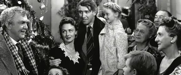 James Stewart family infront of chirstmas tree in black and white