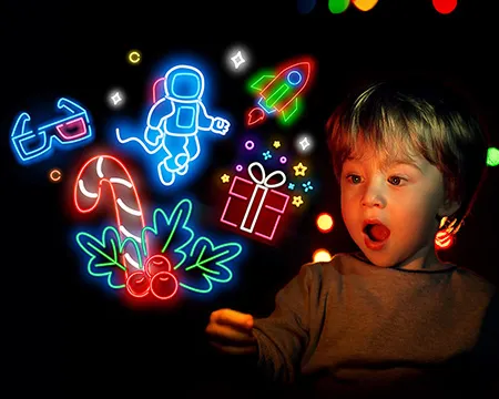 Small boy excitedly looks at several neon icons representing winter events at Glasgow Science Centre