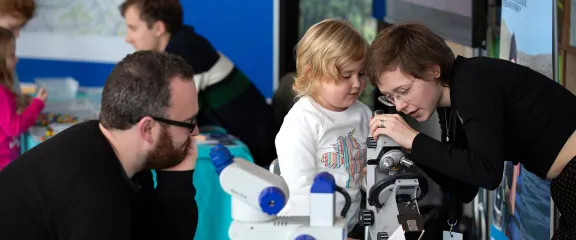 An expert engages a family group with their research
