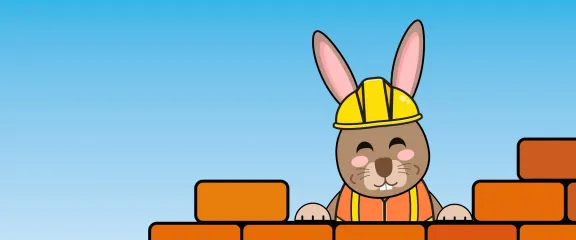 Cartoon rabbit wearing a construction outfit whilst building a wall