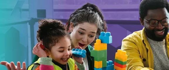 A family play together with colourful building blocks