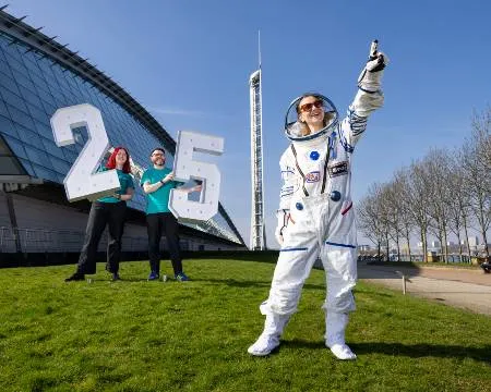 Astronaut Sheena and Science Centre Staff outside centre with giant 25 numbers