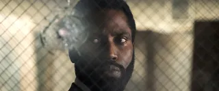 Unnamed protagonist behind window with bullet hold. 