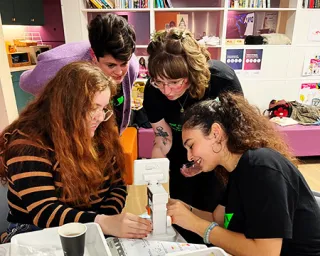 A group of adults sample and explore some DNA