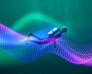 Science Lates - Deep Dive. A scuba diver in the ocean following a purple wave trail
