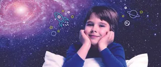 A boy leans over a pillow. In the background there is a starry galaxy spiral.
