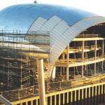 A photograph shows the IMAX building being constructed in January 2000.