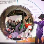 A family dressed as sharks go for a spin in the Hamster Wheel