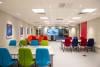 The classroom space with colourful chairs and tables at Newton Flight Academy