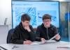 School pupils looking at a map and flight plan in a classroom