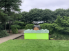 The unusual sculpture in the hidden gardens; a large green box with the top of a womans head appearing from it