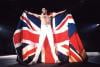 Freddie Mercury on stage with a Union Jack Flag