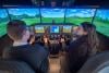 School pupils at the controls of a flight simulator